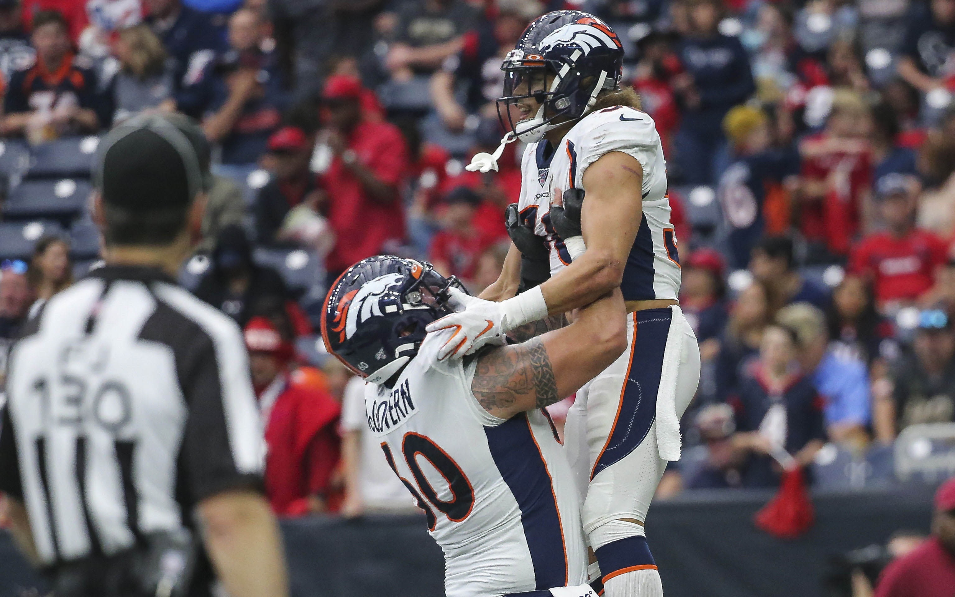 USATSI_13768876 Cropped McGovern lifts Phillip Lindsay in celebration. Credit: Troy Taormina, USA TODAY Sports.