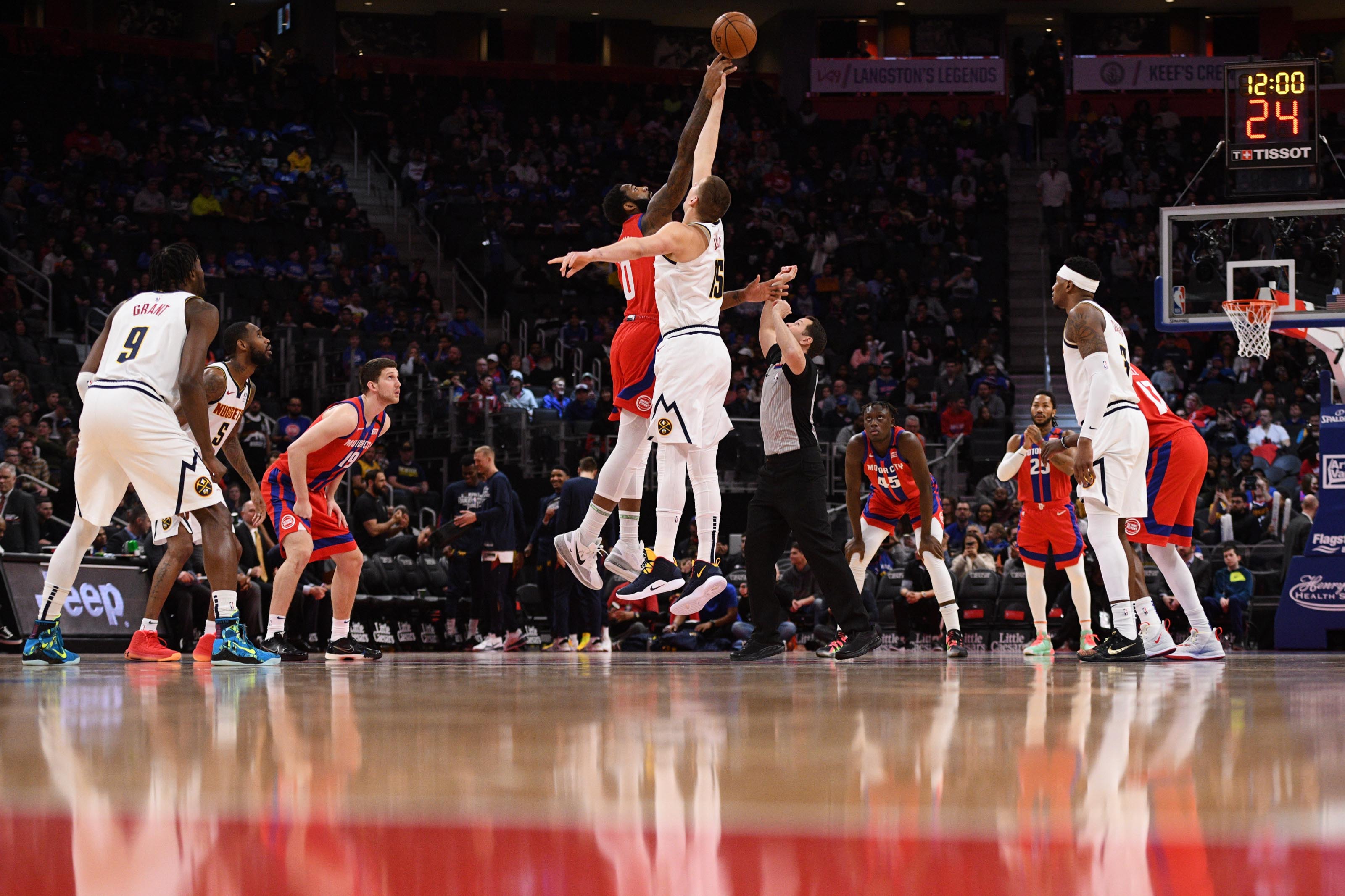 NBA: Denver Nuggets at Detroit Pistons Detroit Pistons center Andre Drummond (0) and Denver Nuggets center Nikola Jokic (15) during the opening tip off at Little Caesars Arena.