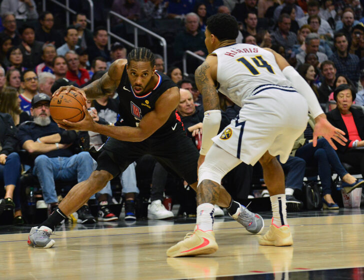 os Angeles Clippers forward Kawhi Leonard (2) controls the ball against Denver Nuggets guard Gary Harris (14) during the second half at Staples Center.