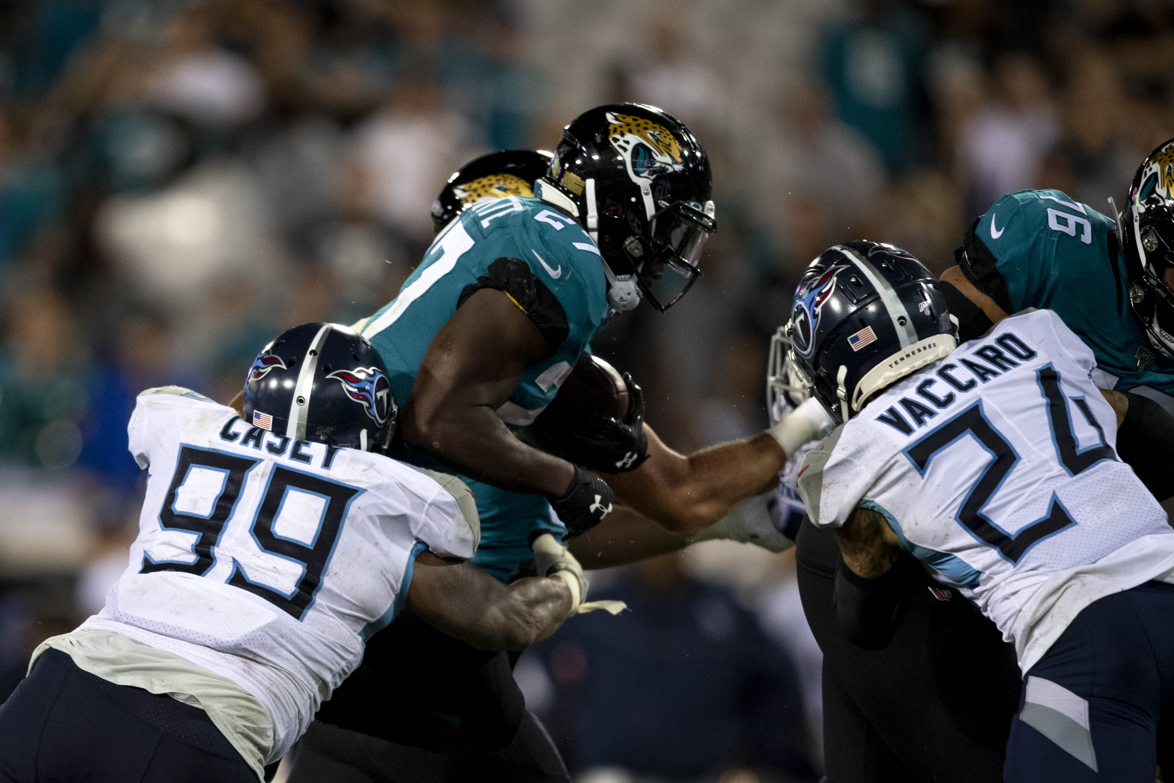 NFL: Tennessee Titans at Jacksonville Jaguars Jacksonville Jaguars running back Leonard Fournette (27) runs the ball as Tennessee Titans defensive end Jurrell Casey (99) defends during the fourth quarter at TIAA Bank Field.