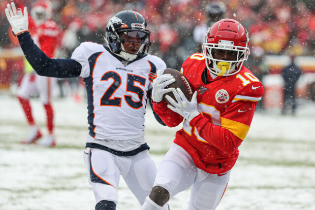 Kansas City Chiefs wide receiver Tyreek Hill (10) burns and embarrasses Denver Broncos cornerback Chris Harris (25) for a touchdown during the first half at Arrowhead Stadium.