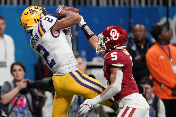 LSU Tigers wide receiver Justin Jefferson (2) catches a pass for a touchdown against Oklahoma Sooners cornerback Woodi Washington (5) during the second quarter of the 2019 Peach Bowl college football playoff semifinal game.