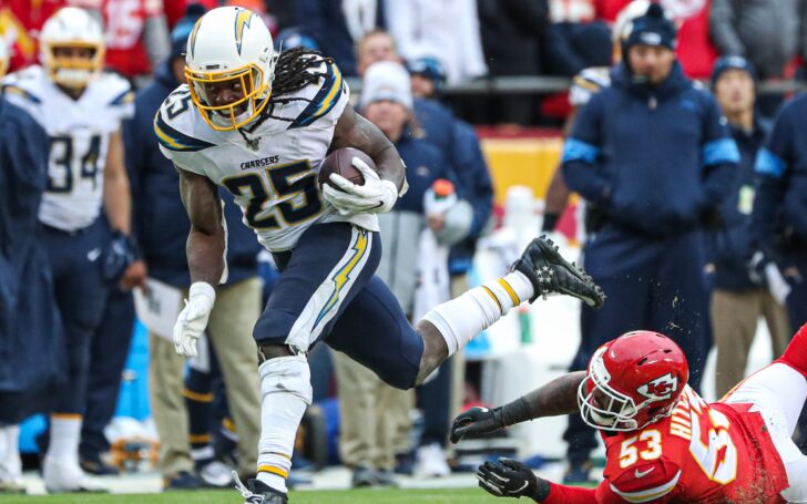 Melvin Gordon runs through a tackle. Credit: Anthony Hitchens, USA TODAY Sports.
