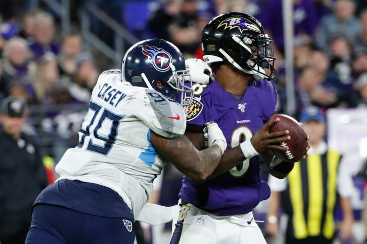 Tennessee Titans defensive end Jurrell Casey (99) causes a fumble by Baltimore Ravens quarterback Lamar Jackson (8) in a AFC Divisional Round playoff football game at M&T Bank Stadium.