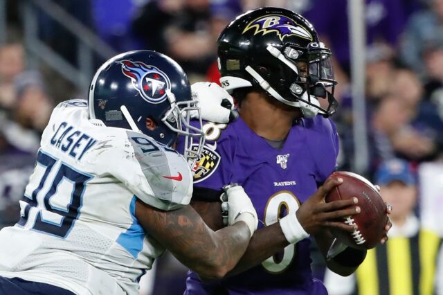 Jurrell Casey forces a sack-fumble of Lamar Jackson. Credit: Geoff Burke, USA TODAY Sports.
