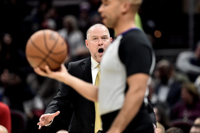 Denver Nuggets head coach Michael Malone argues with referee Matt Myers during the second half against the Cleveland Cavaliers at Rocket Mortgage FieldHouse.