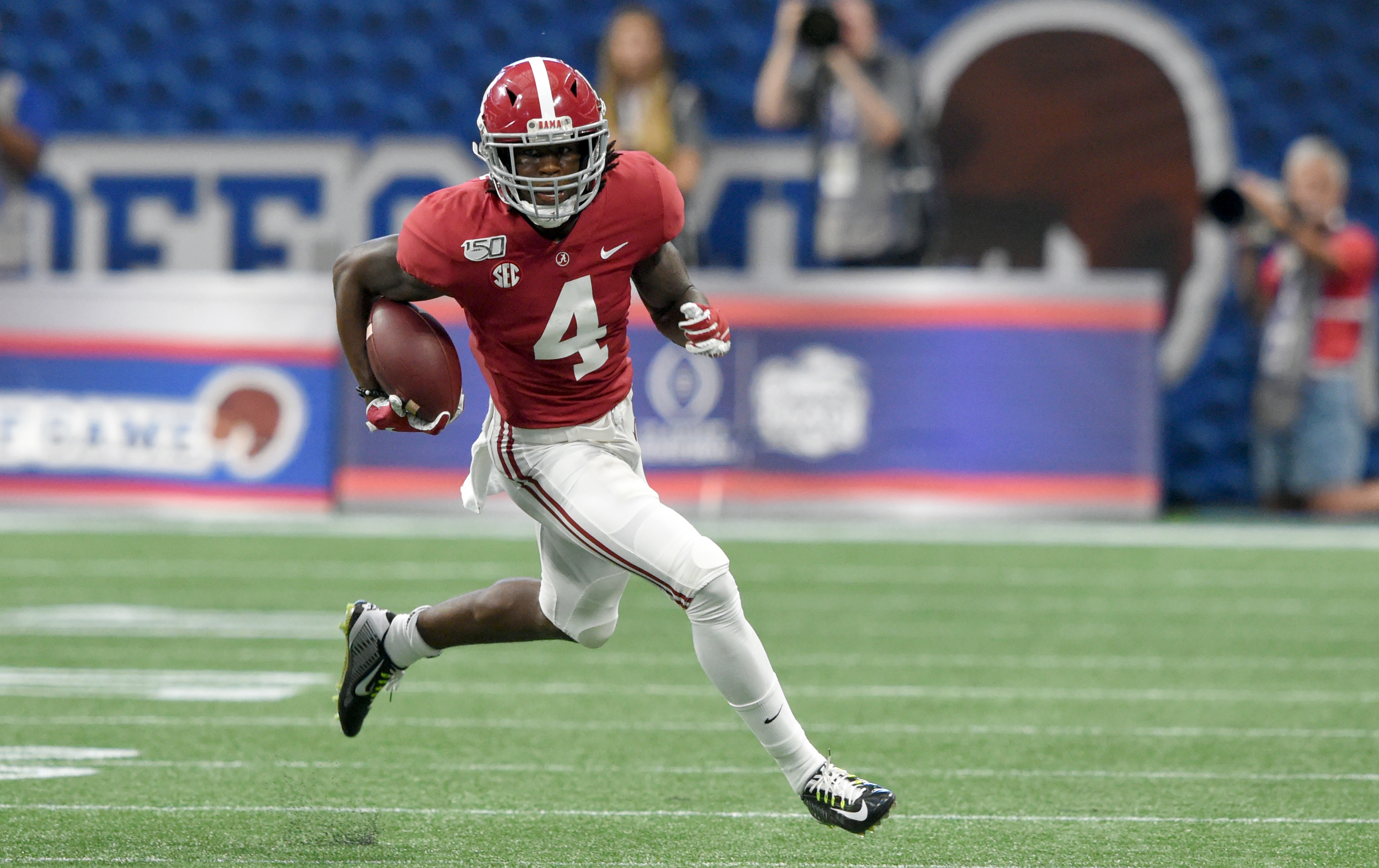 NCAA Football: Alabama vs Duke Alabama Crimson Tide wide receiver Jerry Jeudy (4) carries the ball up the field against the Duke Blue Devils during the first quarter at Mercedes-Benz Stadium.