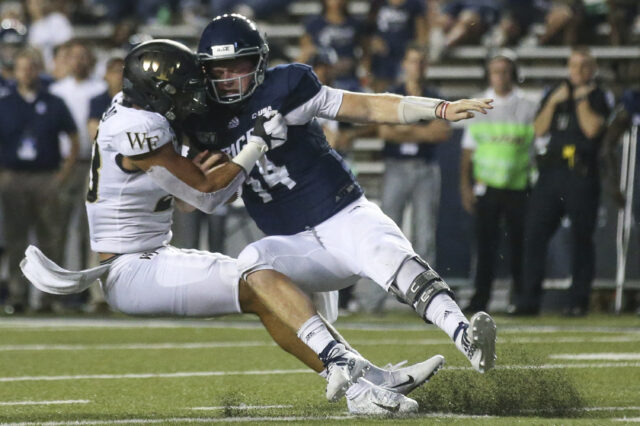 Wake Forest Demon Deacons linebacker Justin Strnad (23) sacks Rice Owls quarterback Tom Stewart (14) for a three yard loss on the one yard line in the fourth quarter at Rice Stadium.