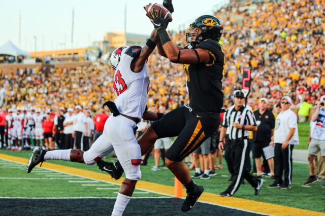 Missouri Tigers tight end Albert Okwuegbunam (81) catches a touchdown pass against Southeast Missouri State Redhawks defensive back Lawrence Johnson (13) during the first half at Memorial Stadium/Faurot Field