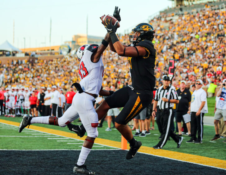 Missouri Tigers tight end Albert Okwuegbunam (81) catches a touchdown pass against Southeast Missouri State Redhawks defensive back Lawrence Johnson (13) during the first half at Memorial Stadium/Faurot Field