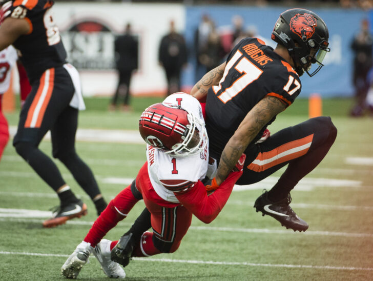 Oregon State Beavers wide receiver Isaiah Hodgins (17) is tackled on a pass play by Utah Utes defensive back Jaylon Johnson (1) during the first half at Reser Stadium.