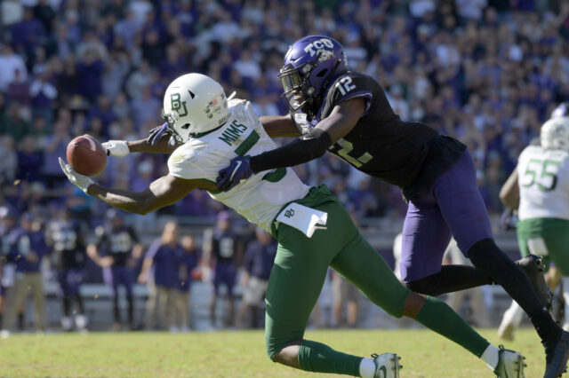 Baylor Bears wide receiver Denzel Mims (5) catches a pass against TCU Horned Frogs cornerback Jeff Gladney (12) in overtime at Amon G. Carter Stadium. Baylor won 29-23 in triple overtime.