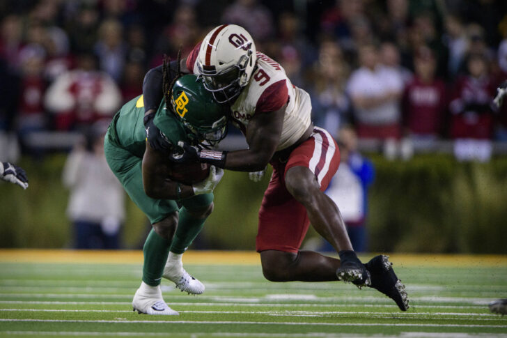 Baylor Bears running back JaMycal Hasty (6) and Oklahoma Sooners linebacker Kenneth Murray (9) in action during the game between the Bears and the Sooners at McLane Stadium.
