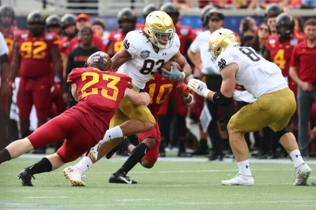 Notre Dame Fighting Irish wide receiver Chase Claypool (83) runs with the back as Iowa State Cyclones linebacker Mike Rose (23) defends during the second half at Camping World Stadium.