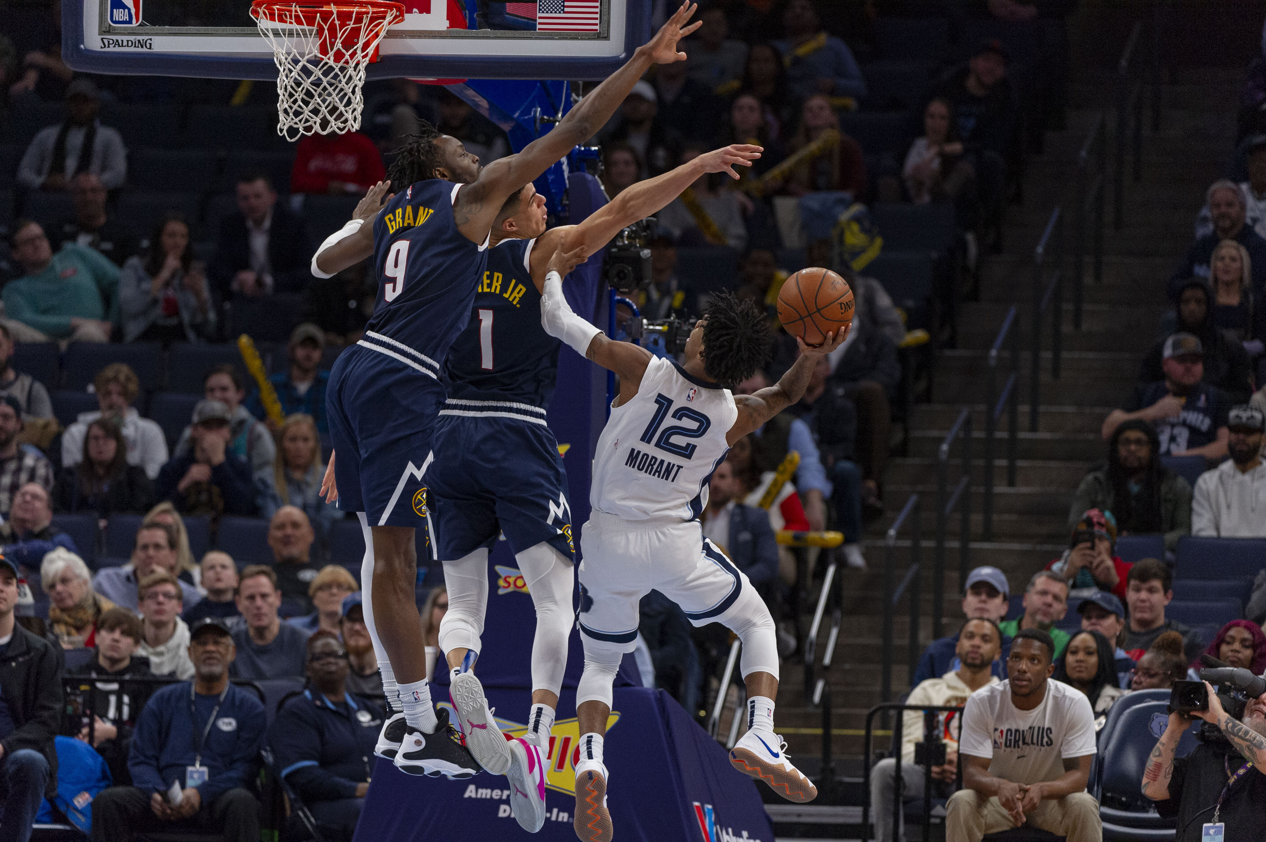 NBA: Denver Nuggets at Memphis Grizzlies Memphis Grizzlies guard Ja Morant (12) goes to the basket against Denver Nuggets forward Michael Porter Jr. (1) during the second half at FedExForum.