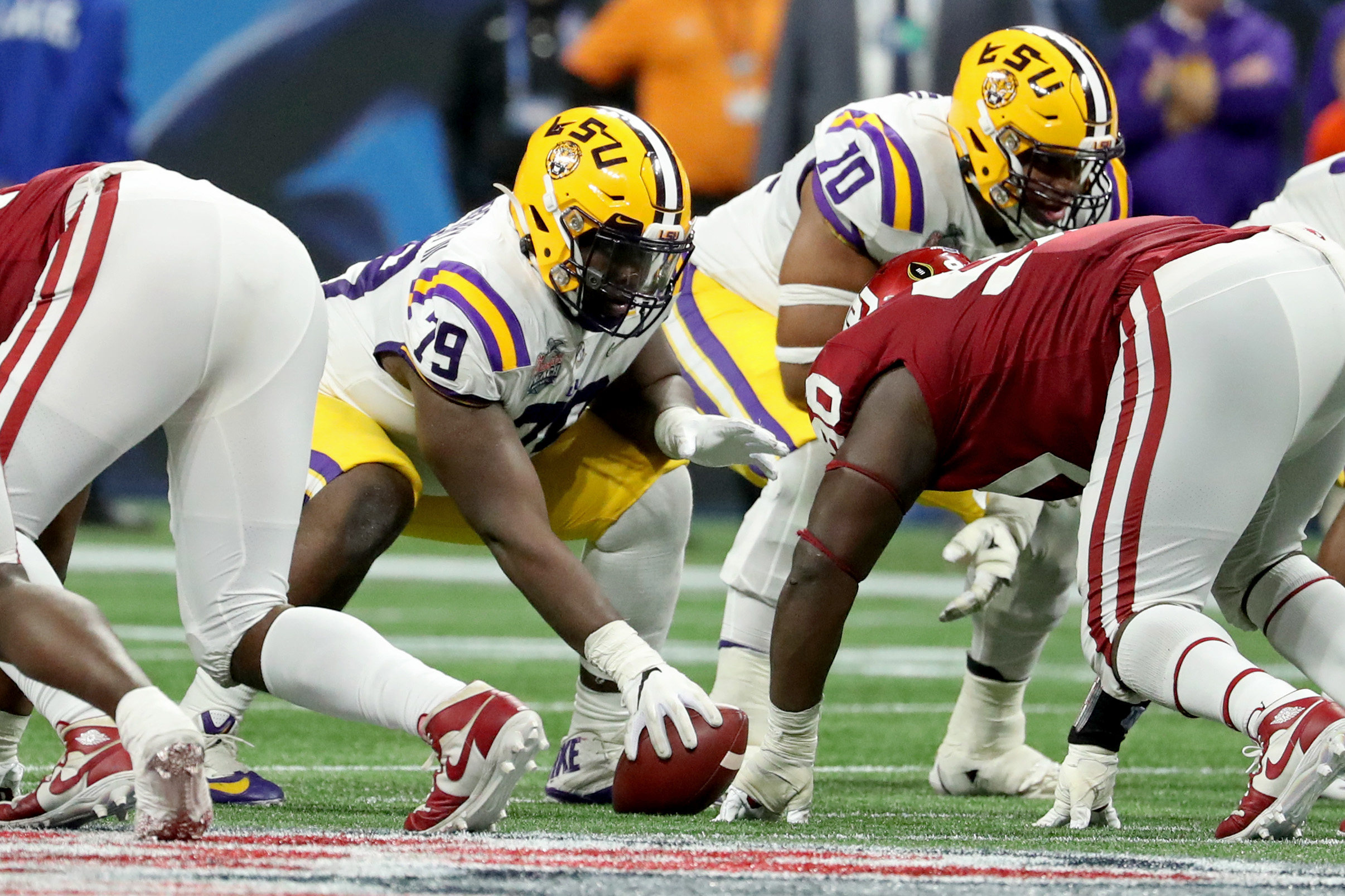 NCAA Football: College Football Playoff Semifinal-Oklahoma vs Louisiana State LSU Tigers center Lloyd Cushenberry III (79) prepares to hike the ball during the 2019 Peach Bowl college football playoff semifinal game against the Oklahoma Sooners at Mercedes-Benz Stadium.