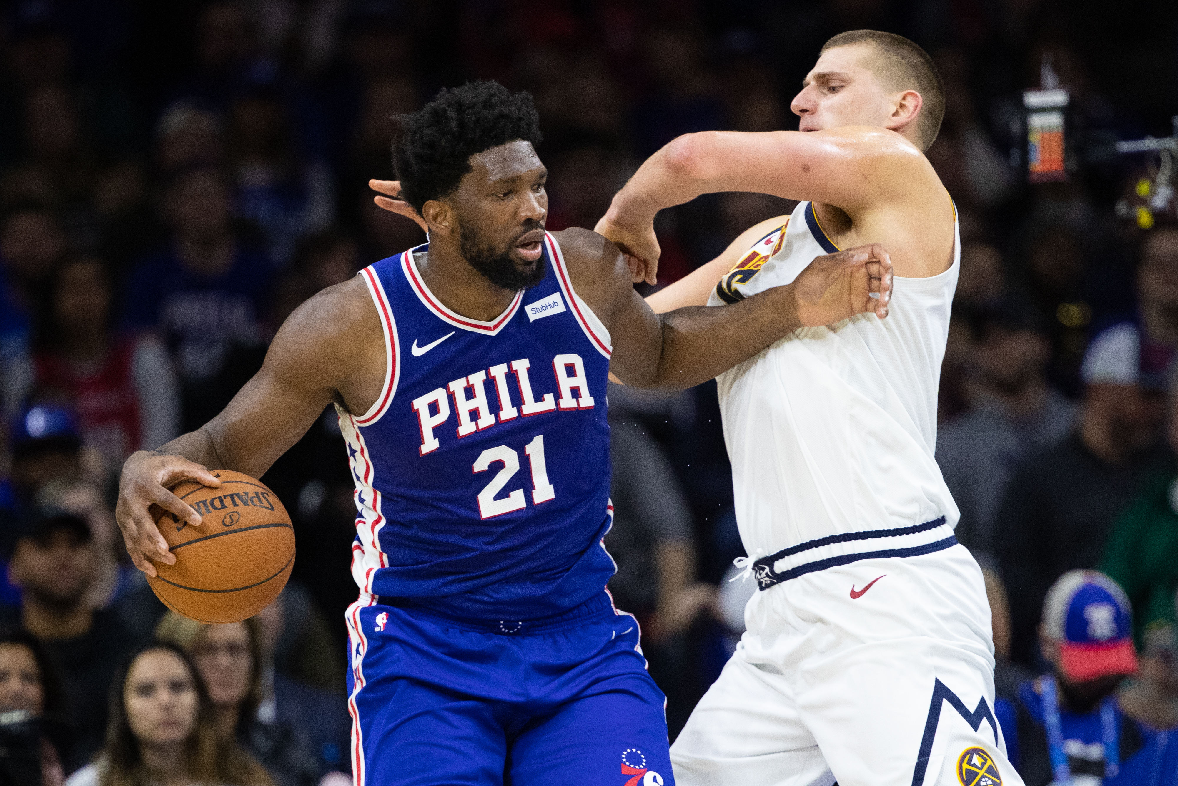 NBA: Denver Nuggets at Philadelphia 76ers Philadelphia 76ers center Joel Embiid (21) controls the ball against Denver Nuggets center Nikola Jokic (15) during the second quarter at Wells Fargo Center.