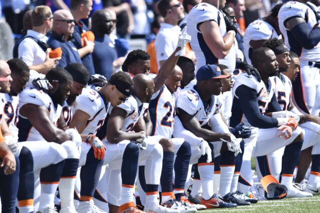 A group of Broncos players kneel for the National Anthem in 2017. Credit: Mark Konezny, USA TODAY Sports.