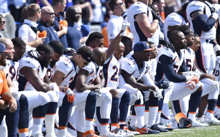 A group of Broncos players kneel for the National Anthem in 2017. Credit: Mark Konezny, USA TODAY Sports.
