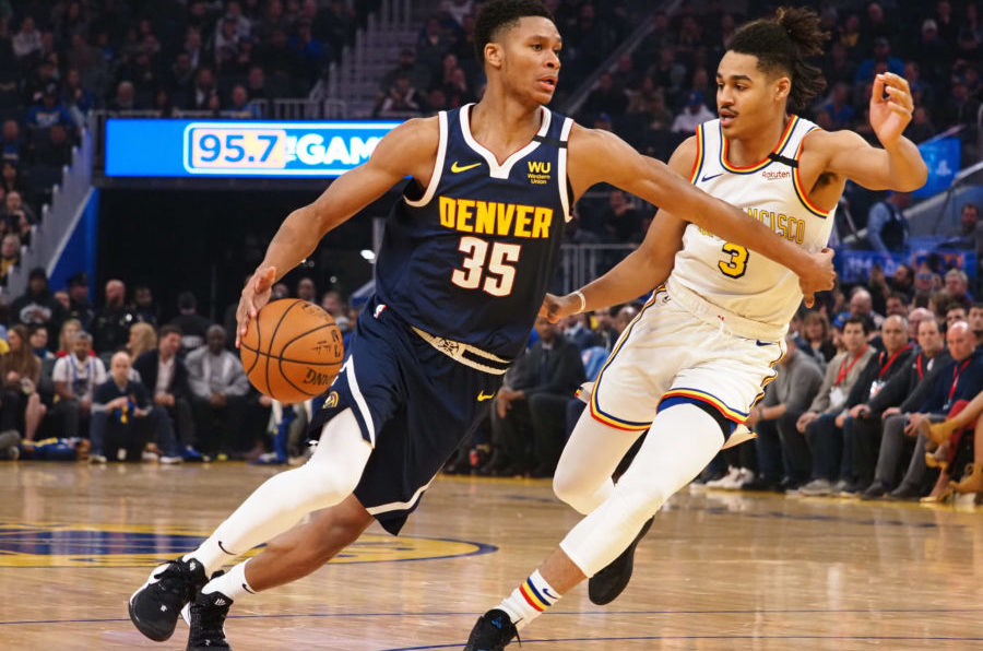 Denver Nuggets guard PJ Dozier (35) drives against Golden State Warriors guard Jordan Poole (3) during the first quarter at Chase Center.