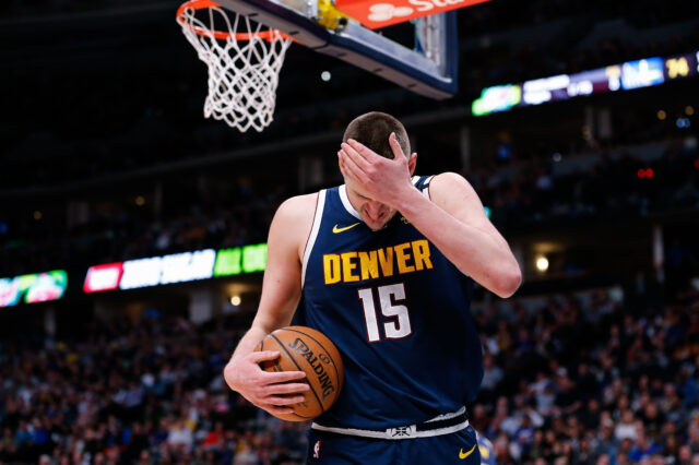 Denver Nuggets center Nikola Jokic (15) reacts after a play in the third quarter against the Golden State Warriors at the Pepsi Center.