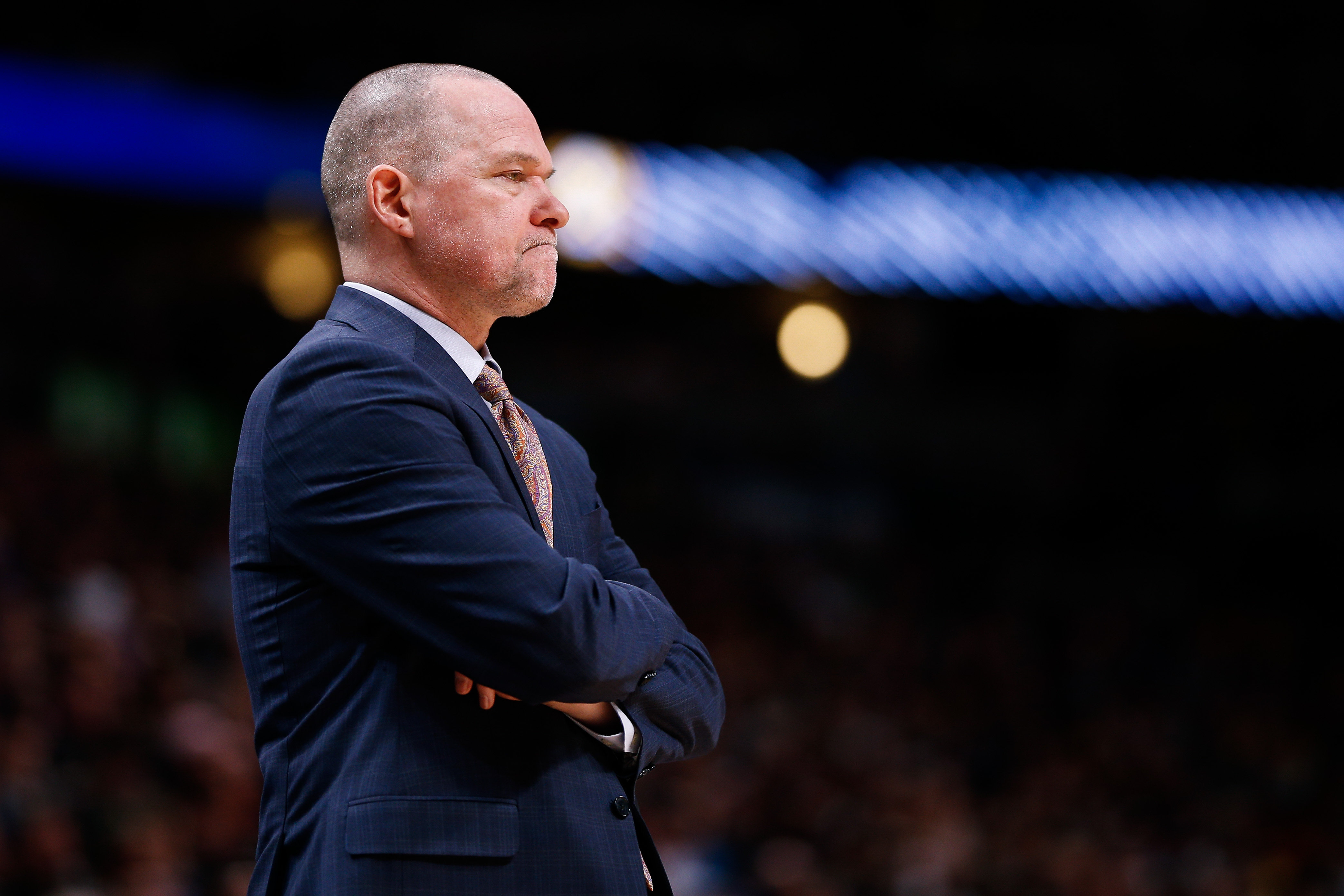 Denver Nuggets head coach Michael Malone looks on in the fourth quarter against the Golden State Warriors at the Pepsi Center.