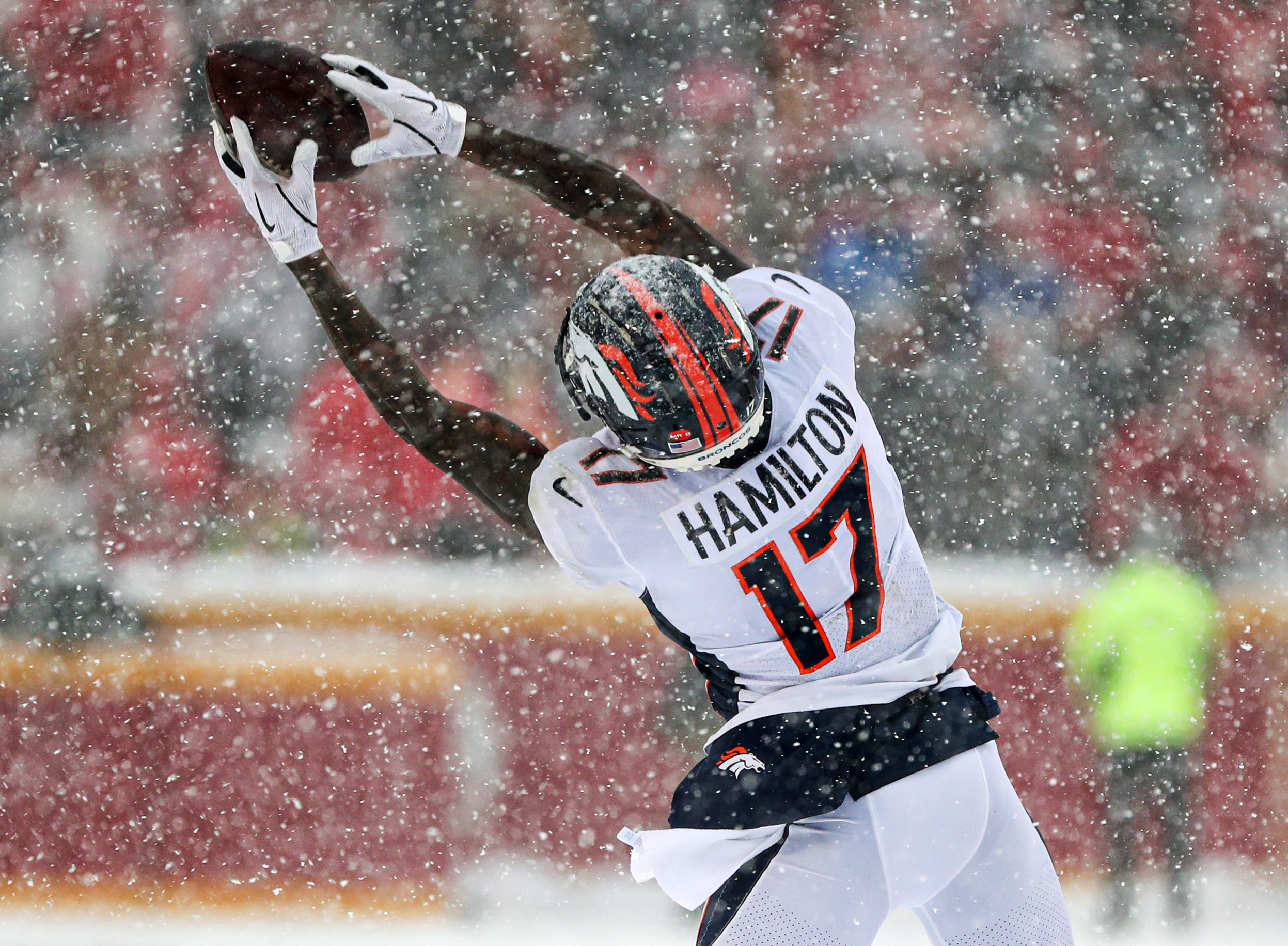 Denver Broncos wide receiver DaeSean Hamilton (17) jumps the ball during the second half against the Kansas City Chiefs at Arrowhead Stadium.