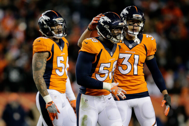 Denver Broncos outside linebacker Von Miller (58) and free safety Justin Simmons (31) and outside linebacker Shane Ray (56) in the fourth quarter against the Oakland Raiders at Sports Authority Field at Mile High.