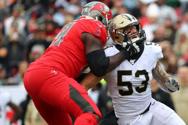 Tampa Bay Buccaneers offensive tackle Demar Dotson (69) blocks New Orleans Saints outside linebacker A.J. Klein (53) during the first half at Raymond James Stadium.