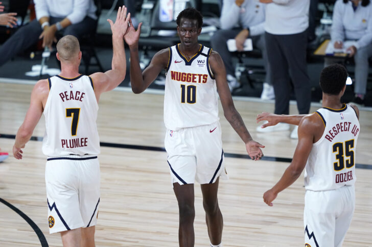Denver Nuggets' Bol Bol (10) is congratulated by PJ Dozier (35) and Mason Plumlee (7) during the second half of an NBA basketball game Monday, Aug. 10, 2020, in Lake Buena Vista, Fla. at AdventHealth Arena.