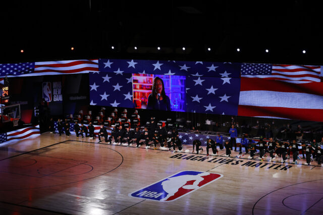 Denver Nuggets and Utah Jazz teams kneel during the National Anthem in game five of the first round of the 2020 NBA Playoffs at ESPN Wide World of Sports Complex.