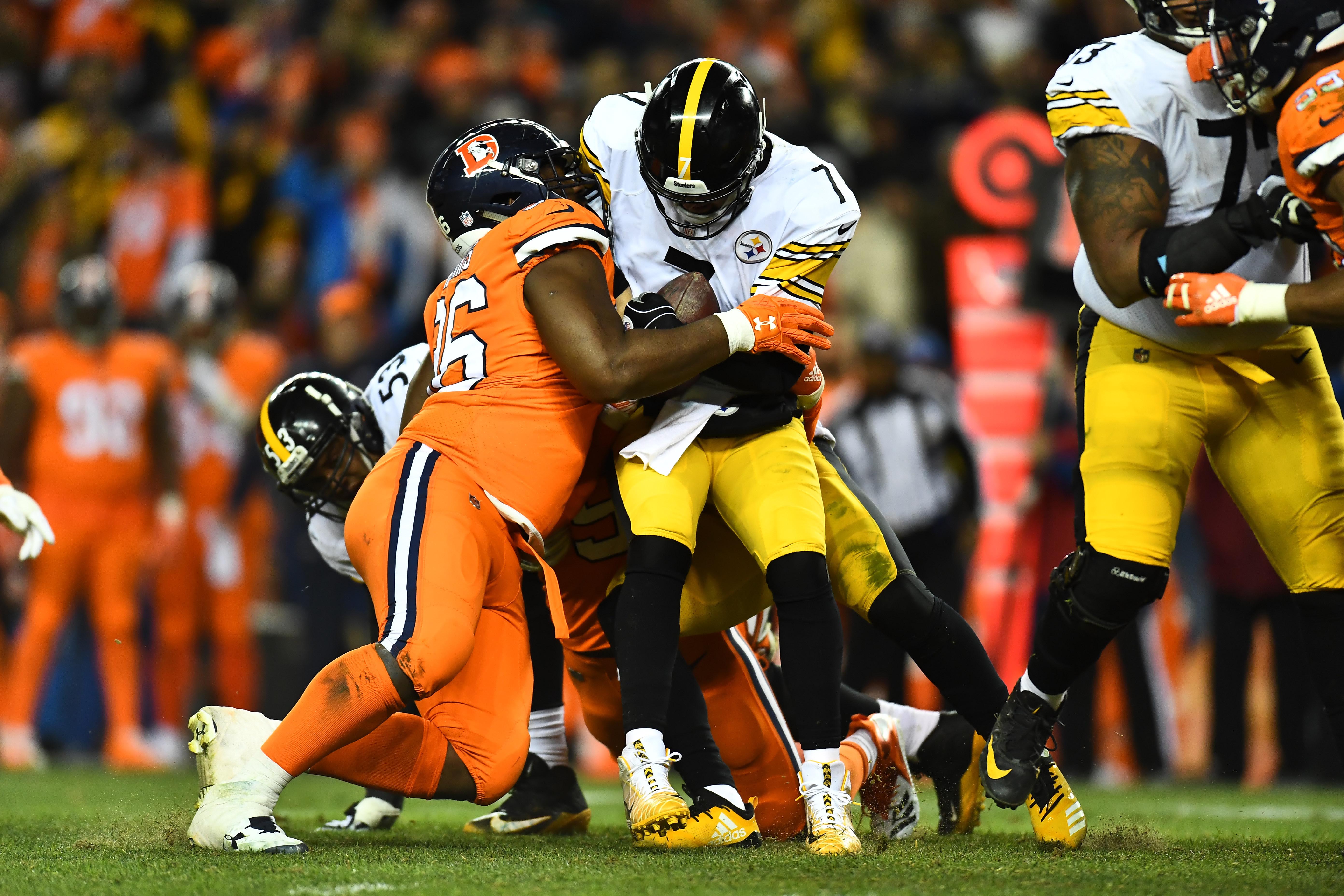 Pittsburgh Steelers quarterback Ben Roethlisberger (7) is sacked by Denver Broncos defensive end Shelby Harris (96) in the fourth quarter at Broncos Stadium at Mile High.