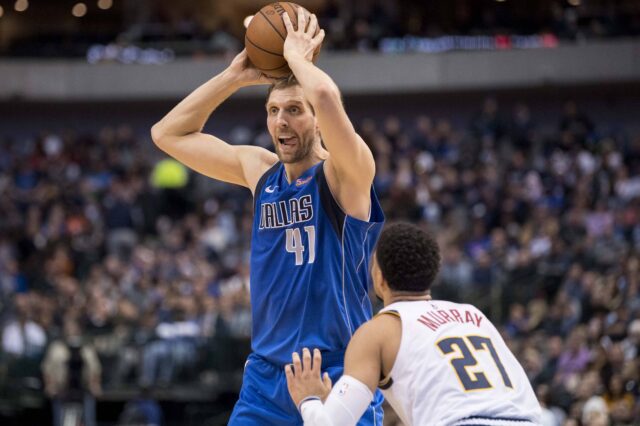 Dallas Mavericks forward Dirk Nowitzki (41) looks to pass the ball over Denver Nuggets guard Jamal Murray (27) during second quarter at the American Airlines Center.