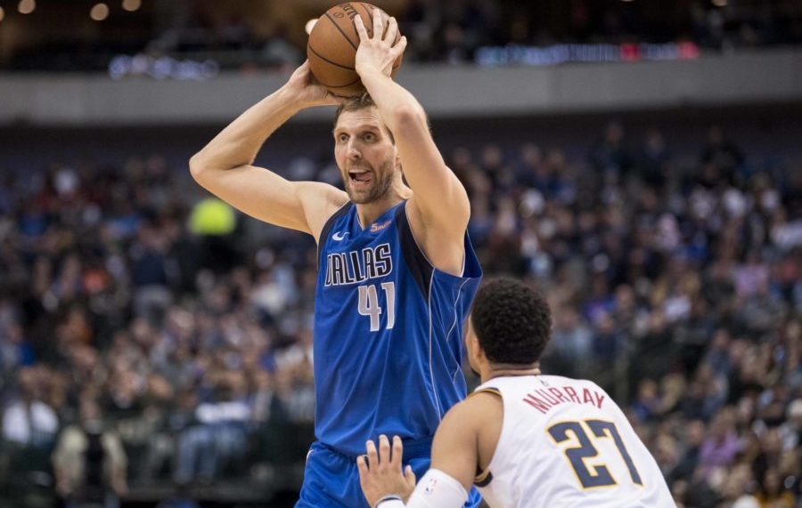 Dallas Mavericks forward Dirk Nowitzki (41) looks to pass the ball over Denver Nuggets guard Jamal Murray (27) during second quarter at the American Airlines Center.
