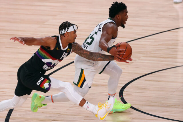 Denver Nuggets guard Gary Harris (14) pressures Utah Jazz guard Donovan Mitchell (45) during the second half of game seven of the first round of the 2020 NBA Playoffs at ESPN Wide World of Sports Complex.
