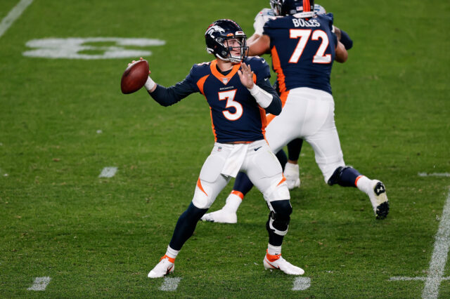 Denver Broncos quarterback Drew Lock (3) attempts a pass in the second quarter against the Tennessee Titans at Empower Field at Mile High.