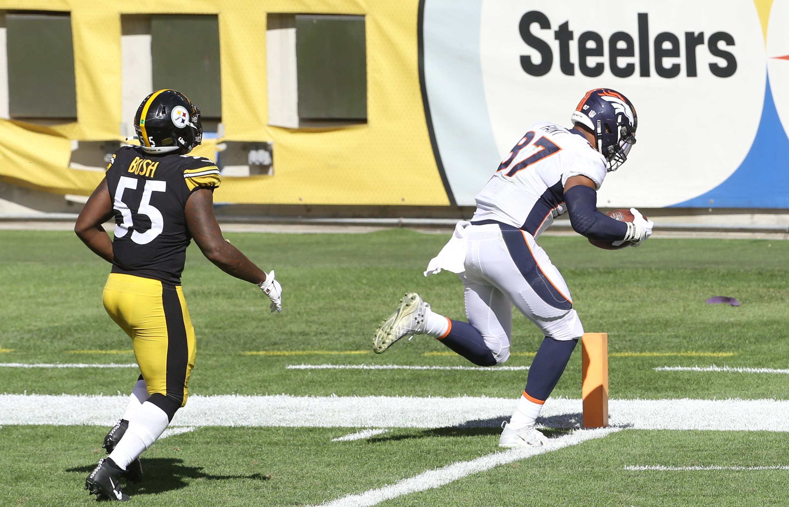 NFL: Denver Broncos at Pittsburgh Steelers Denver Broncos tight end Noah Fant (87) scores a twenty yard touchdown behind Pittsburgh Steelers linebacker Devin Bush (55) during the third quarter at Heinz Field.