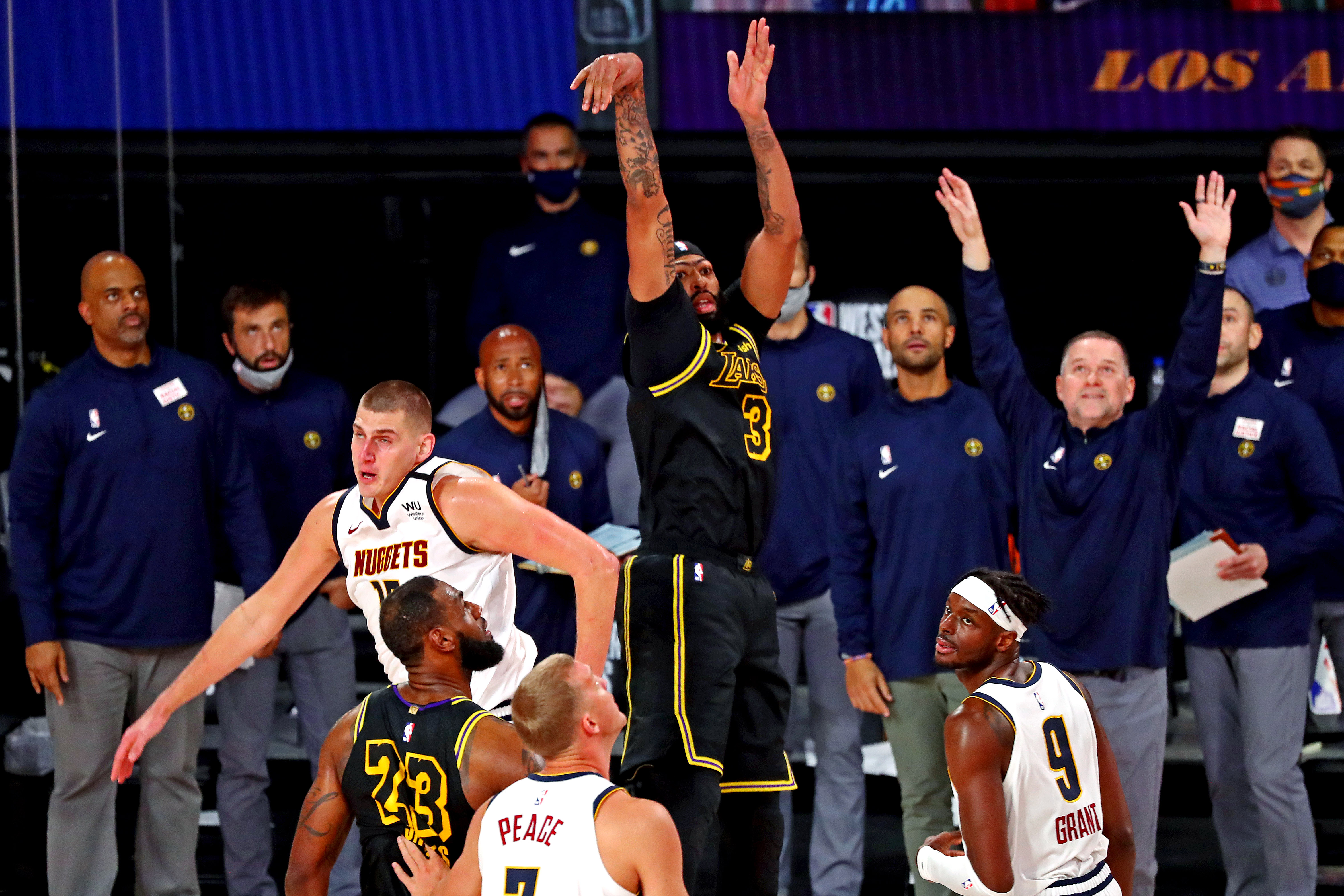 Los Angeles Lakers forward Anthony Davis (3) makes the game winning basket against Denver Nuggets center Nikola Jokic (15) during the fourth quarter in game two of the Western Conference Finals of the 2020 NBA Playoffs at AdventHealth Arena.