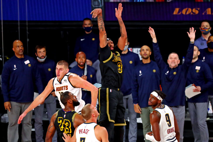 Los Angeles Lakers forward Anthony Davis (3) makes the game winning basket against Denver Nuggets center Nikola Jokic (15) during the fourth quarter in game two of the Western Conference Finals of the 2020 NBA Playoffs at AdventHealth Arena.