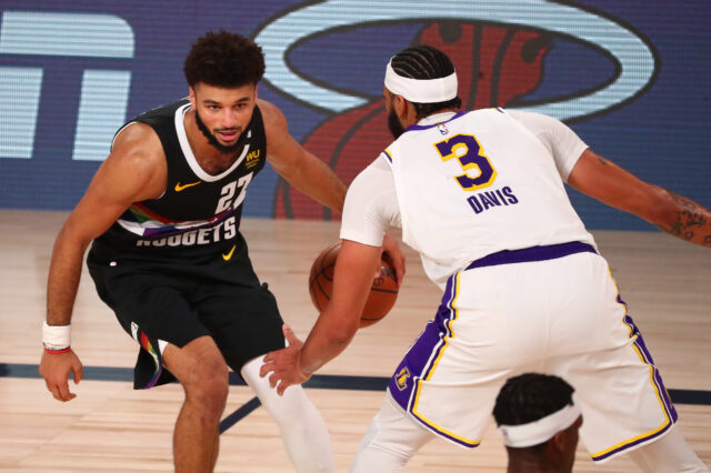 Denver Nuggets guard Jamal Murray (27) dribbles the ball against Los Angeles Lakers forward Anthony Davis (3) during the second half of game three of the Western Conference Finals of the 2020 NBA Playoffs at AdventHealth Arena.