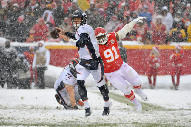 Denver Broncos quarterback Drew Lock (3) throws a pass as Kansas City Chiefs nose tackle Derrick Nnadi (91) attempts the sack during the second half at Arrowhead Stadium.