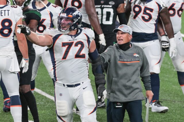 Garett Bolles is held back by Vic Fangio at the end of Broncos - Jets. Credit: Vincent Carchietta, USA TODAY Sports.
