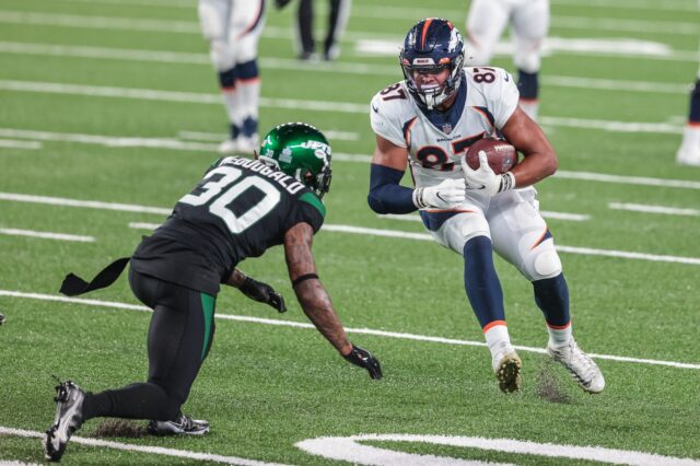 Denver Broncos tight end Noah Fant (87) gains yards after catch as New York Jets strong safety Bradley McDougald (30) defends during the second half at MetLife Stadium.
