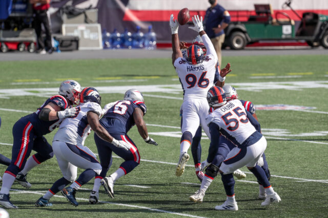 Denver Broncos defensive end Shelby Harris (96) deflects a pass by New England Patriots quarterback Cam Newton (not pictured) during the first half at Gillette Stadium.