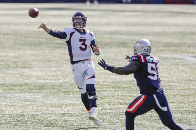 Denver Broncos quarterback Drew Lock (3) throws under pressure from New England Patriots linebacker Ja'Whaun Bentley (51) during the second quarter at Gillette Stadium