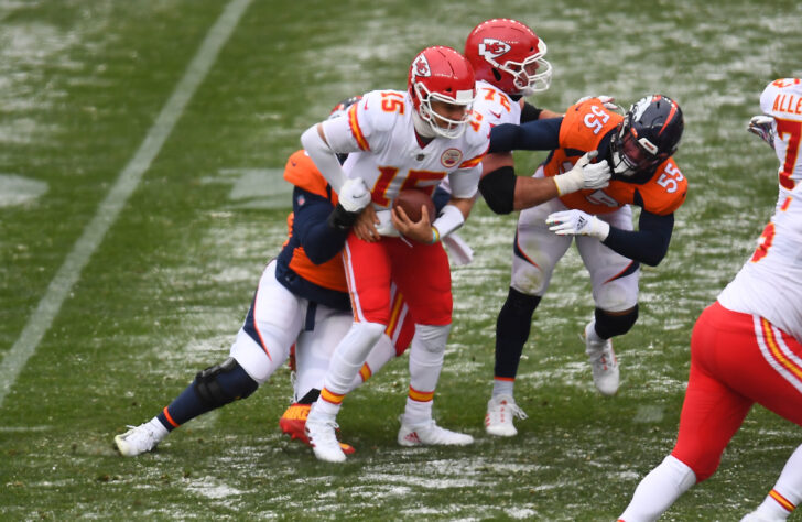 Kansas City Chiefs quarterback Patrick Mahomes (15) is sacked by Denver Broncos defensive end Dre'Mont Jones (93) in the first half at Empower Field at Mile High.