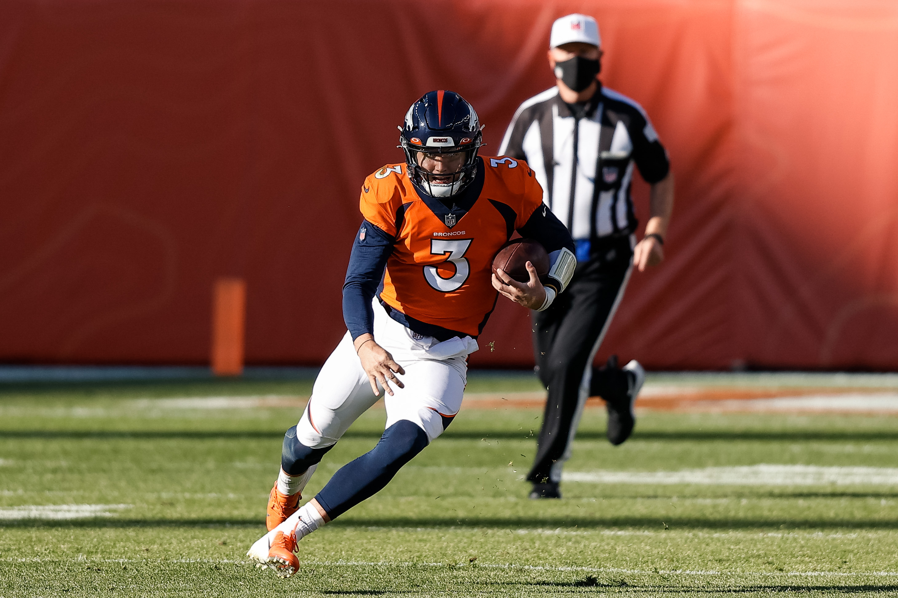Denver Broncos quarterback Drew Lock (3) runs the ball in the first quarter against the Los Angeles Chargers at Empower Field at Mile High.