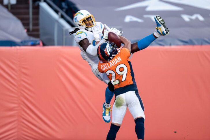 Denver Broncos cornerback Bryce Callahan (29) battles for the ball with Los Angeles Chargers wide receiver Mike Williams (81) in the third quarter at Empower Field at Mile High.