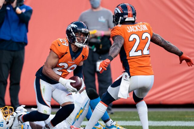 Nov 1, 2020; Denver, Colorado, USA; Denver Broncos cornerback Bryce Callahan (29) celebrates with strong safety Kareem Jackson (22) after intercepting a pass intended for Los Angeles Chargers wide receiver Mike Williams (81) in the third quarter at Empower Field at Mile High. Mandatory Credit: Isaiah J. Downing-USA TODAY Sports