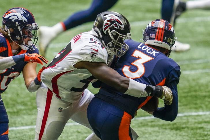 Atlanta Falcons linebacker Foyesade Oluokun (54) tackles Denver Broncos quarterback Drew Lock (3) for a loss during the first half at Mercedes-Benz Stadium.